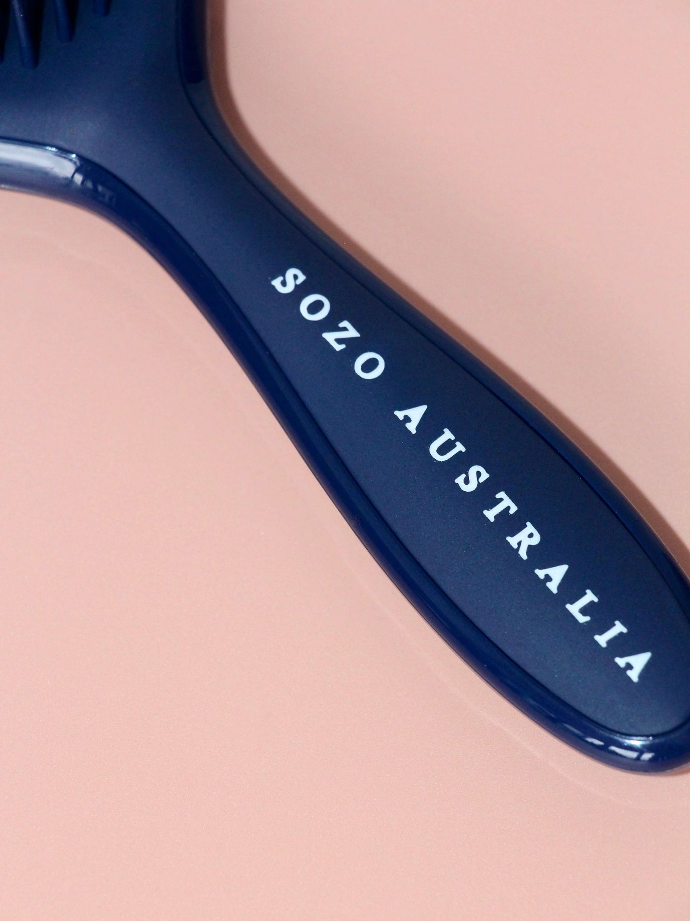 Handle of the Sozo Australia Detangling Hairbrush