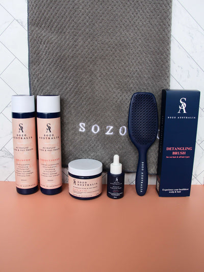 Sozo Australia's Complete Scalp & Haircare Bundle that contains a natural shampoo, conditioner, hair mask, hair serum, detangling hair brush and bamboo microfibre hair towel